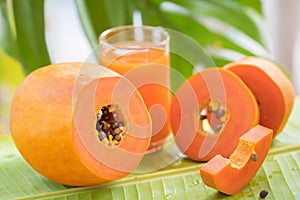 Tropical exotic papaya fruit and glass jar with smoothie shake j