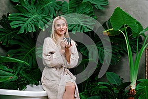 Tropical and exotic spa garden with bathtub in modern hotel or resort. Blithe