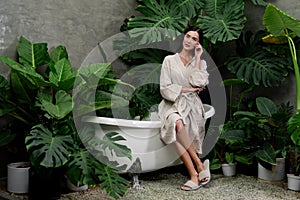 Tropical and exotic spa garden with bathtub in modern hotel or resort. Blithe