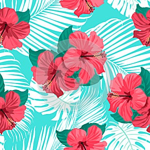 Tropical flowers and palm leaves on background. Seamless.