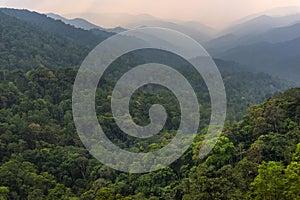 Tropical forest with mountains and majestic orange sky and clouds. Camping site at Maewong National Park, Nakhonsawan, Thailand