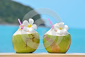 Tropical fresh coconut cocktail decorated plumeria