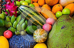 Tropical fruit background. Raw and ripe exotic fruit closeup photo. Vegetarian wallpaper.