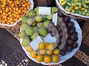 Tropical fruit in a basket on a street market stall in funchal madeira photo