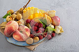 Tropical fruit plate with mango and peaches