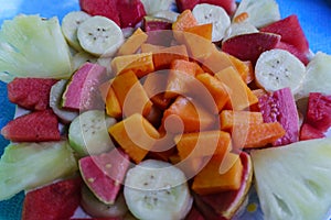 Tropical fruit salad in detail, colorful and delicious plate