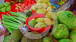 Tropical fruit vegetables on counter of street market vendor