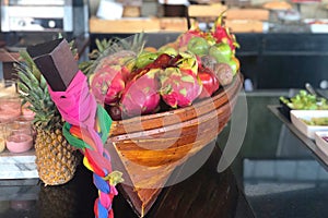 Tropical fruits in boat-shape basket in Thailand