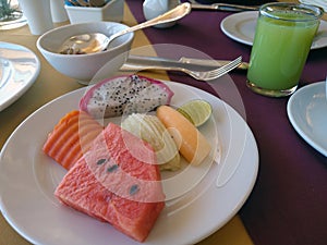 Tropical fruits on a breakfast plate