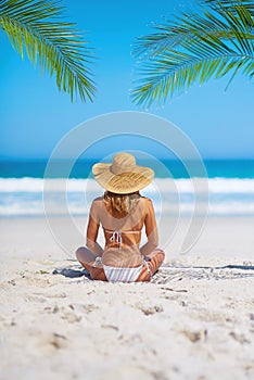 Tropical, holiday and back of woman on beach sand for adventure, summer and vacation in Mauritius. Travel mockup, ocean