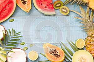 Tropical holiday summer abstract background with palms and fruits