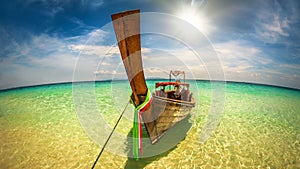 Tropical holidays vacation trips. Long tail boat on exotic beach