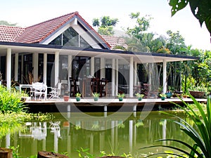 Tropical house veranda & natural pond