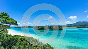 Tropical island beach and clear blue lagoon, Okinawa, Japan