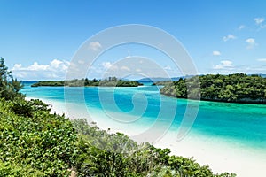Tropical island beach and clear blue lagoon, Okinawa, Japan