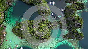 Tropical island with boats in lagoons