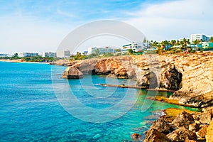 Tropical island cliff coast with ocean blue water and a beautiful coastline