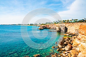 Tropical island cliff coast with ocean blue water and a beautiful coastline