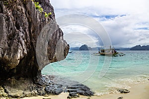 Tropical island landscape with bangca traditional phillipinians boats with tourists, Entalula, island, Palawan