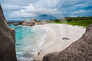 Tropical island landscape of secret beautiful beach, Anse Marron, La Digue, Seychelles