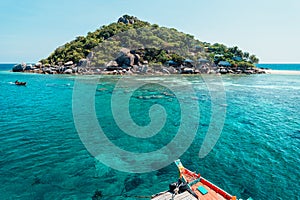 tropical island and long-tail boat