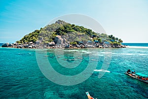 tropical island and long-tail boat