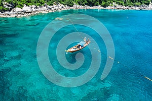 tropical island and long-tail boat