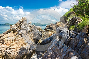 Tropical island rock on the beach with blue sky. Koh kham pattaya thailand