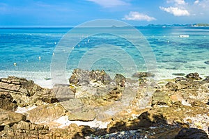 Tropical island rock on the beach with blue sky. Koh kham pattaya thailand