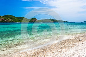 Tropical island rock on the beach with blue sky. Koh kham pattaya thailand