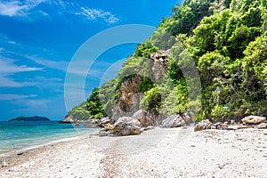 Tropical island rock on the beach with blue sky. Koh kham pattaya thailand