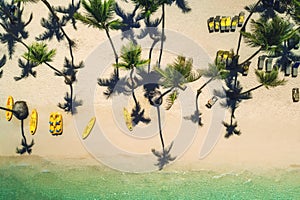 Tropical island and surf catamaran and canoe, aerial top view. Punta Cana, Dominican Republic