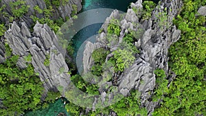 Tropical island with tourists in lagoons