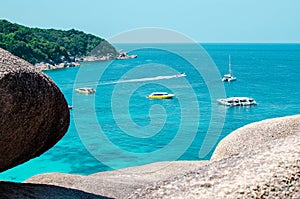 Tropical islands of ocean blue sea water and white sand beach at Similan Islands with famous Sail Rock, Phang Nga