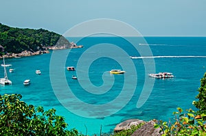 Tropical islands of ocean blue sea water and white sand beach at Similan Islands with famous Sail Rock, Phang Nga