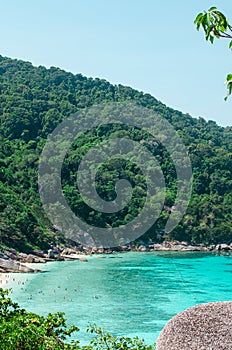 Tropical islands of ocean blue sea water and white sand beach at Similan Islands with famous Sail Rock, Phang Nga