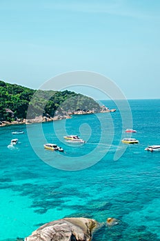 Tropical islands of ocean blue sea water and white sand beach at Similan Islands with famous Sail Rock, Phang Nga