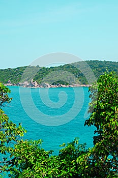 Tropical islands of ocean blue sea water and white sand beach at Similan Islands with famous Sail Rock, Phang Nga