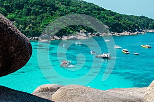 Tropical islands of ocean blue sea water and white sand beach at Similan Islands with famous Sail Rock, Phang Nga