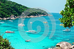 Tropical islands of ocean blue sea water and white sand beach at Similan Islands with famous Sail Rock, Phang Nga