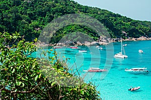 Tropical islands of ocean blue sea water and white sand beach at Similan Islands with famous Sail Rock, Phang Nga