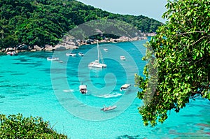 Tropical islands of ocean blue sea water and white sand beach at Similan Islands with famous Sail Rock, Phang Nga