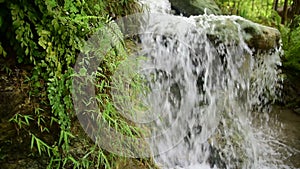 Tropical jungle waterfall with strong stream