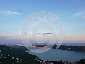 tropical landscape in the bay of Puerto Marques in Acapulco, Mexico at sunset