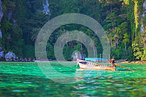 Tropical landscape, traditional long tail boat, Thailand Phi-Phi island.