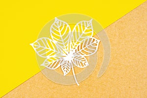 Tropical leaf made from paper cutting on yellow background