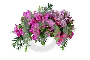 Tropical leaves and flower garland bouquet arrangement mixes orchids flower with tropical foliage fern, philodendron and ruscus