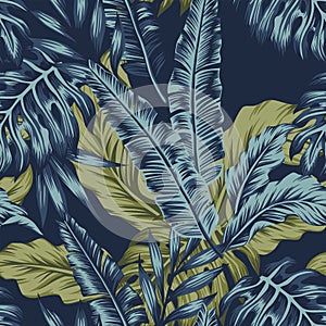 Tropical leaves green seamless dark blue background