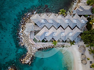 Tropical luxury resort Curacao with pirvate beach and palm trees, luxury vacation Curacao