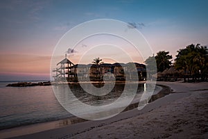 Tropical luxury resort Curacao with pirvate beach and palm trees, luxury vacation Curacao